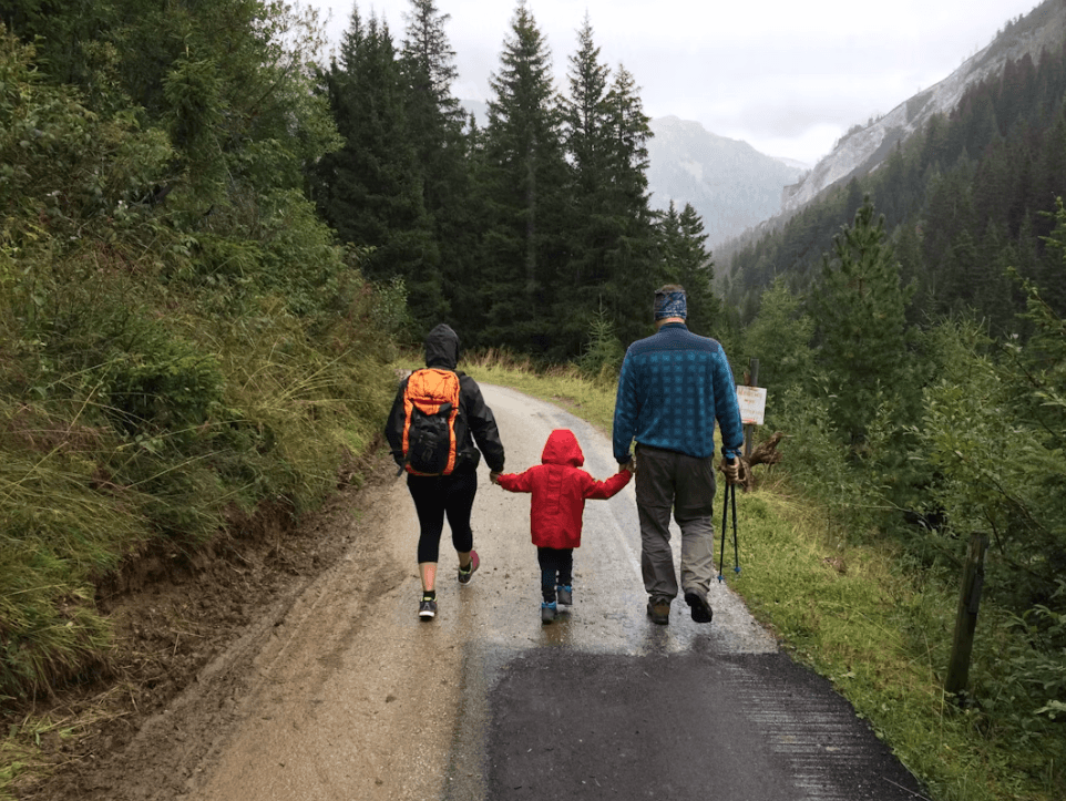 A family walking together in a forest